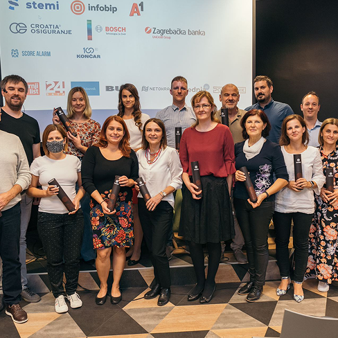 People standing in group holding plaquettes