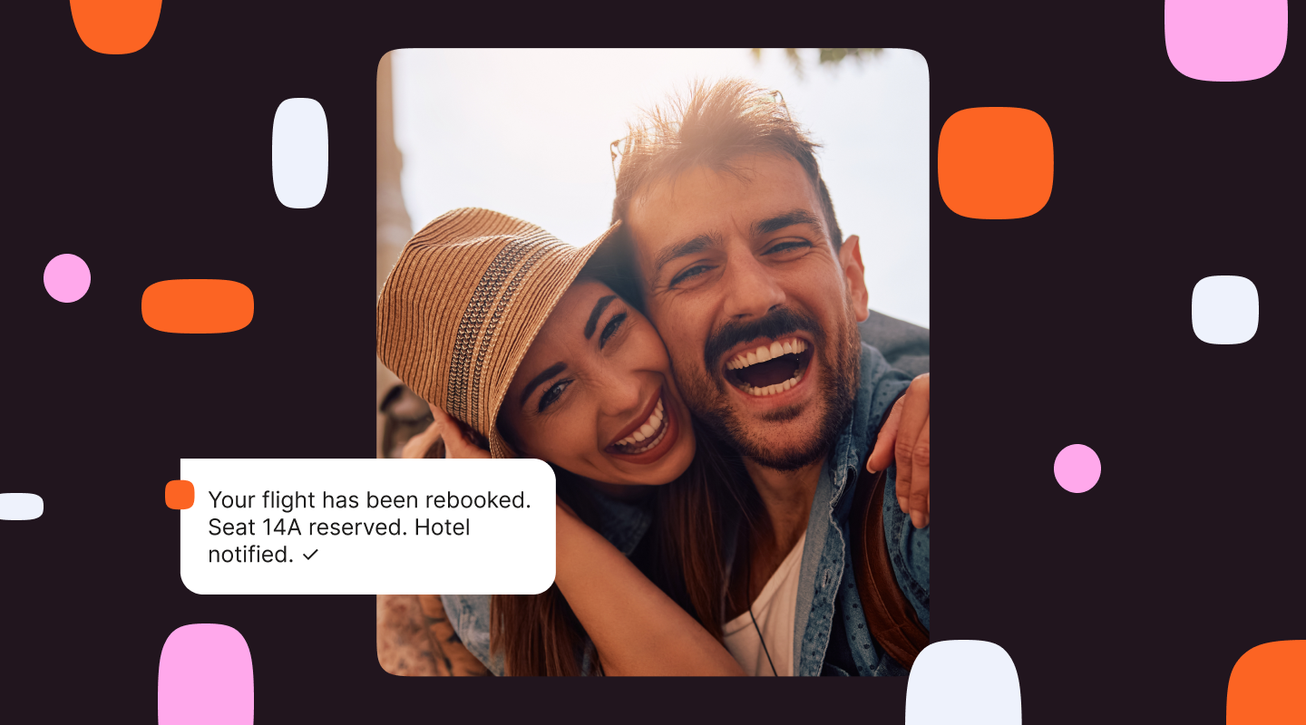 A smiling couple against a dark branded background, with a white notification bubble reading: "Your flight has been rebooked. Seat 14A reserved. Hotel notified."