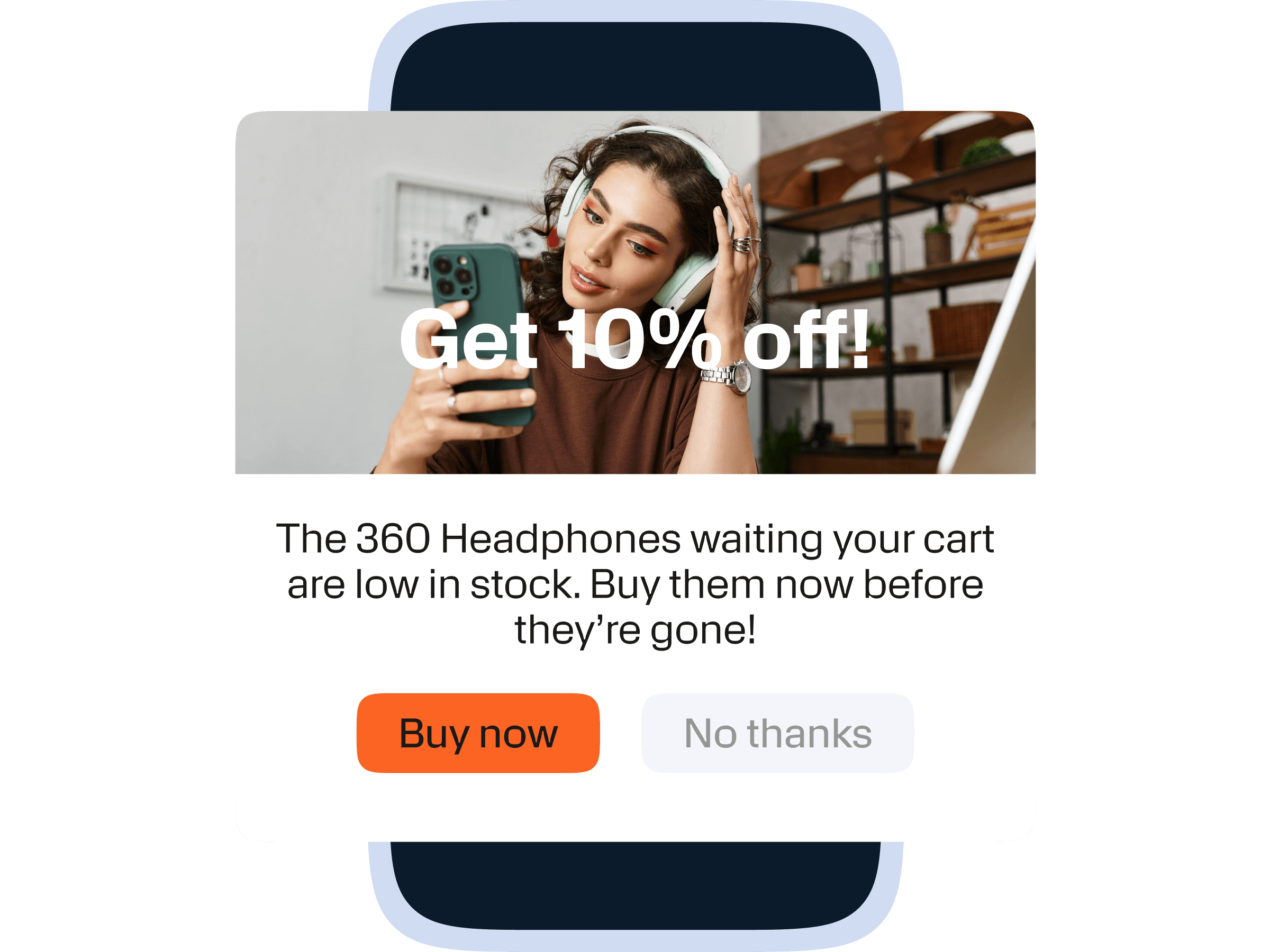 A promotional notification on a smartphone screen showing a person wearing headphones and holding a smartphone, sitting in a room with shelves in the background. Over the image is a bold white text overlay saying "Get 10% off!" Below, the message informs that "The 360 Headphones waiting your cart are low in stock. Buy them now before they’re gone!" There are two buttons at the bottom: an orange "Buy now" button and a gray "No thanks" button.