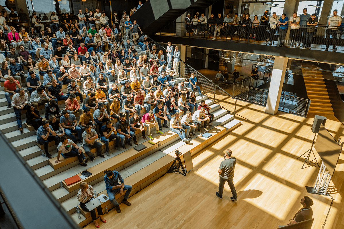 Infobip campus with people sitting in hall